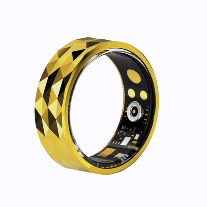 Gold and black ring with geometric pattern on a white background