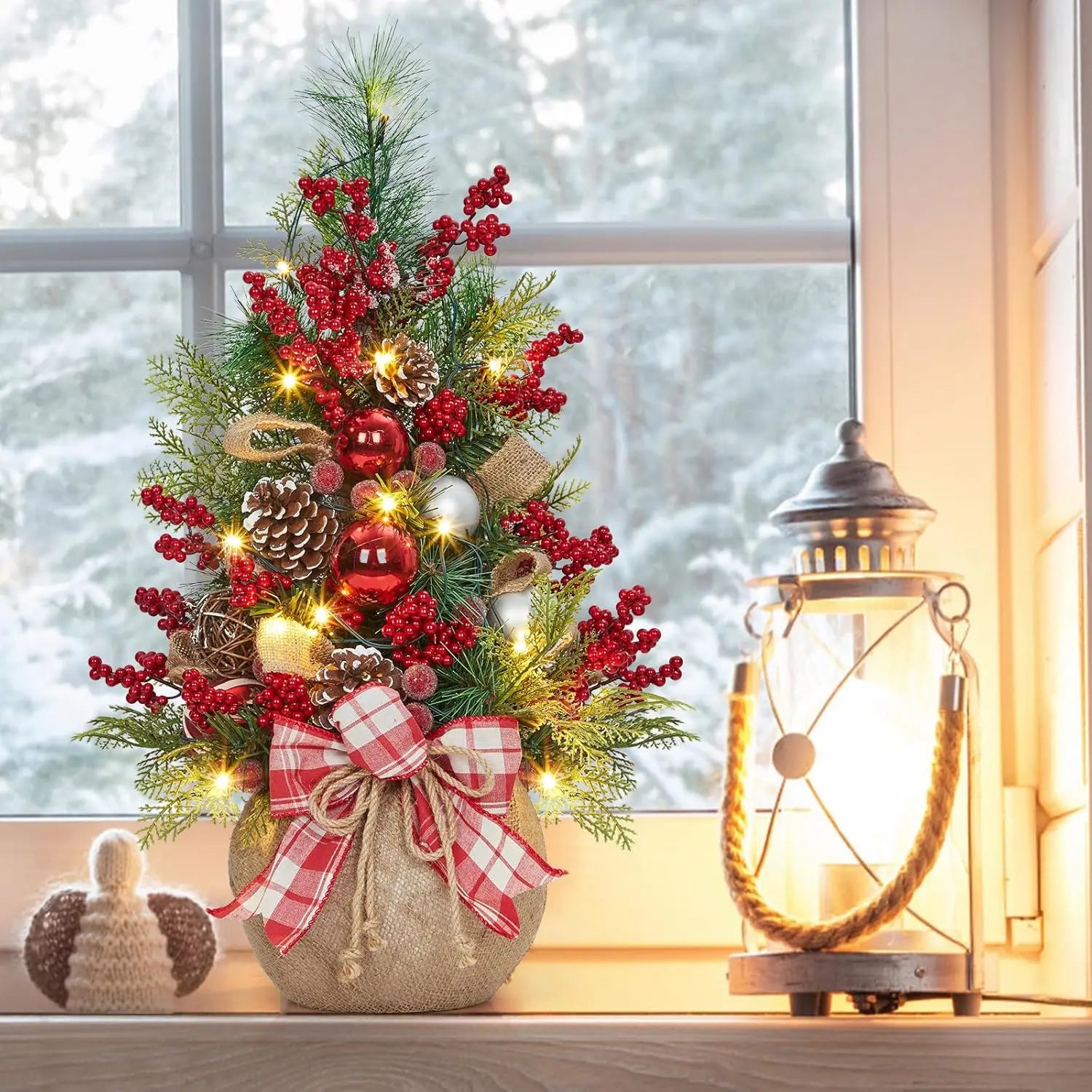 24-Inch Pre-Lit Mini Christmas Tree with red berries, pine cones, and warm LED lights, perfect for small spaces.