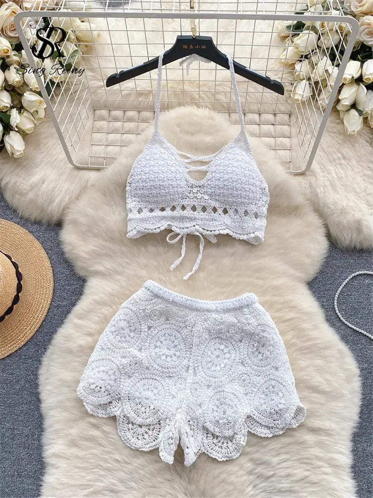 Knitted two-piece beachwear set for women featuring a knitted top and matching shorts, ideal for summer, beach, and vacation wear.