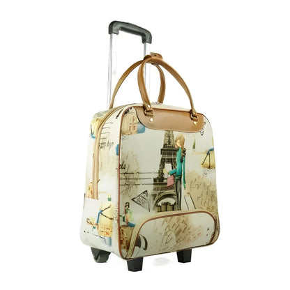 A rolling travel bag with an Eiffel Tower and Parisian script collage print, featuring tan leather handles and trim, a telescoping silver handle, and wheels.