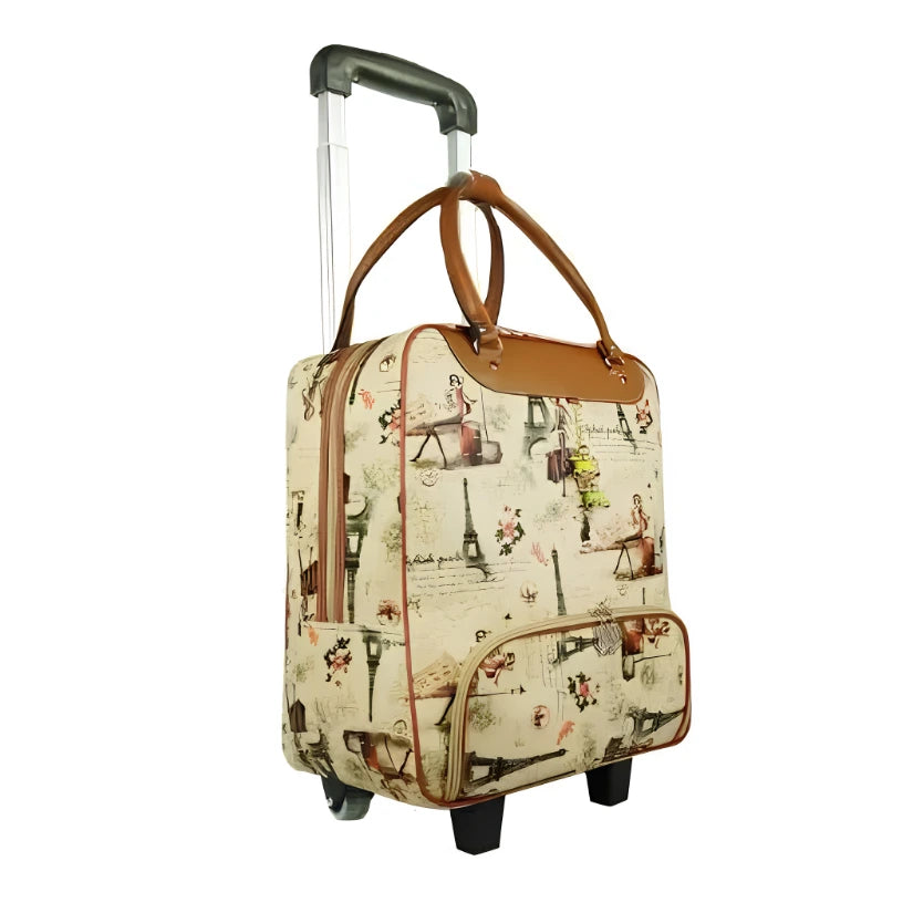 A beige rolling suitcase with a vintage Paris-themed print, featuring brown leather handles and trim, a telescoping silver handle, and black wheels, shown on a plain white background.
